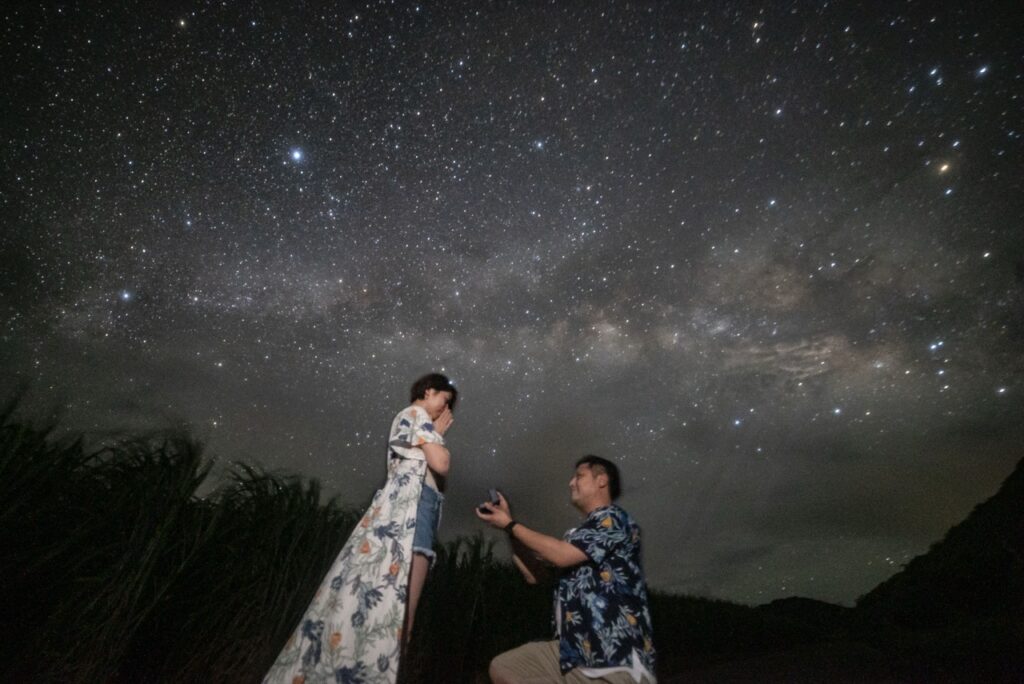 Proposal kneeling starry sky at Nagareboshi no Oka stargazing spot, Ishigaki Island