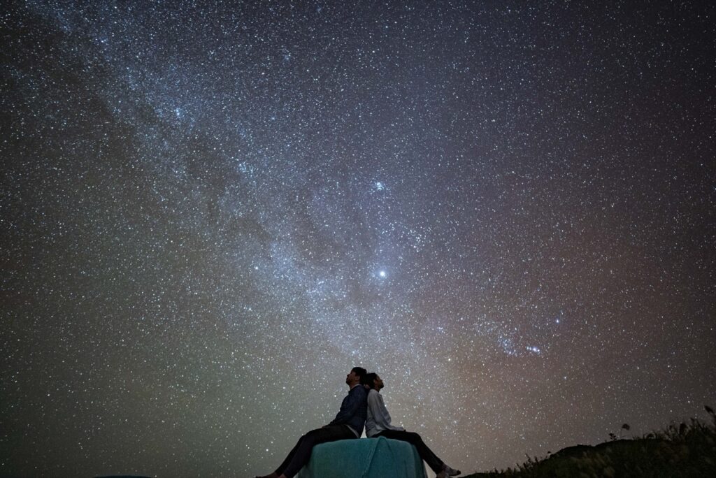 Couple tent kiss milky way at Nagareboshi no Oka stargazing spot, Ishigaki Island