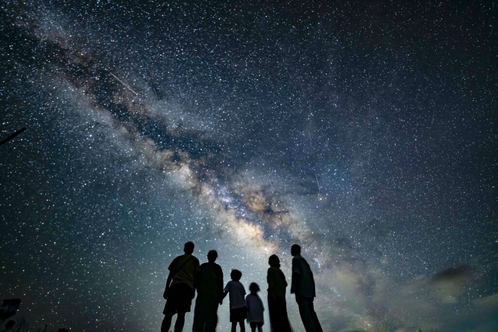 Family silhouette milky way enhanced at Nagareboshi no Oka stargazing spot, Ishigaki Island