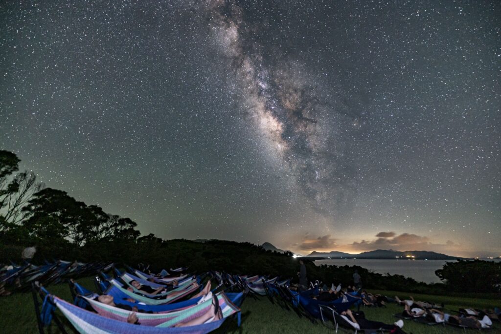 Hammock milky way group landscape at Nagareboshi no Oka stargazing spot, Ishigaki Island